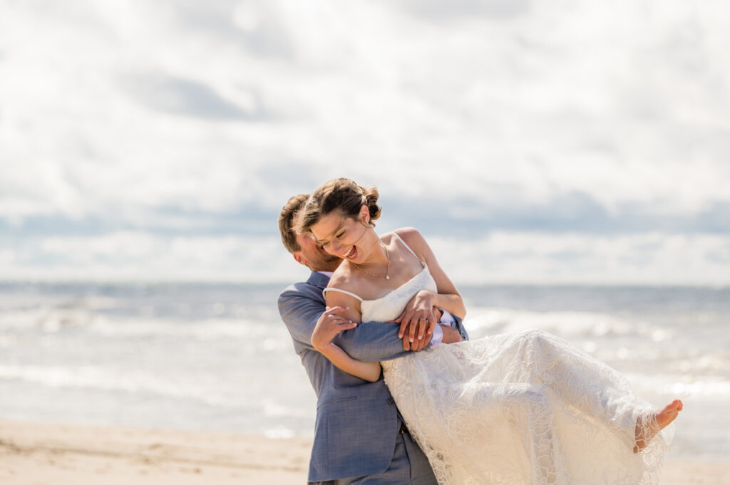 Smiling couple on beach after wedding