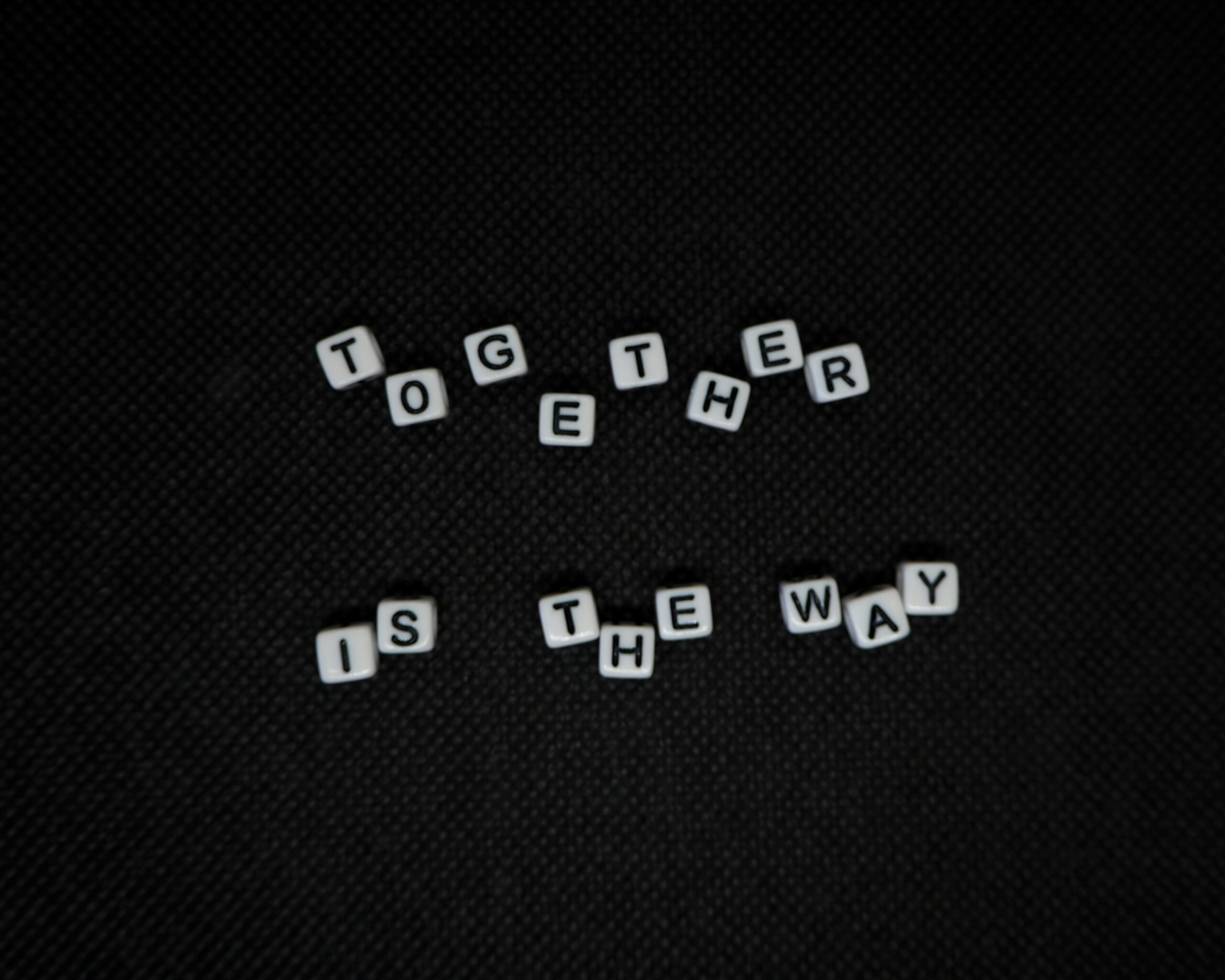 Scrabble tiles spell 'Together is the way'
